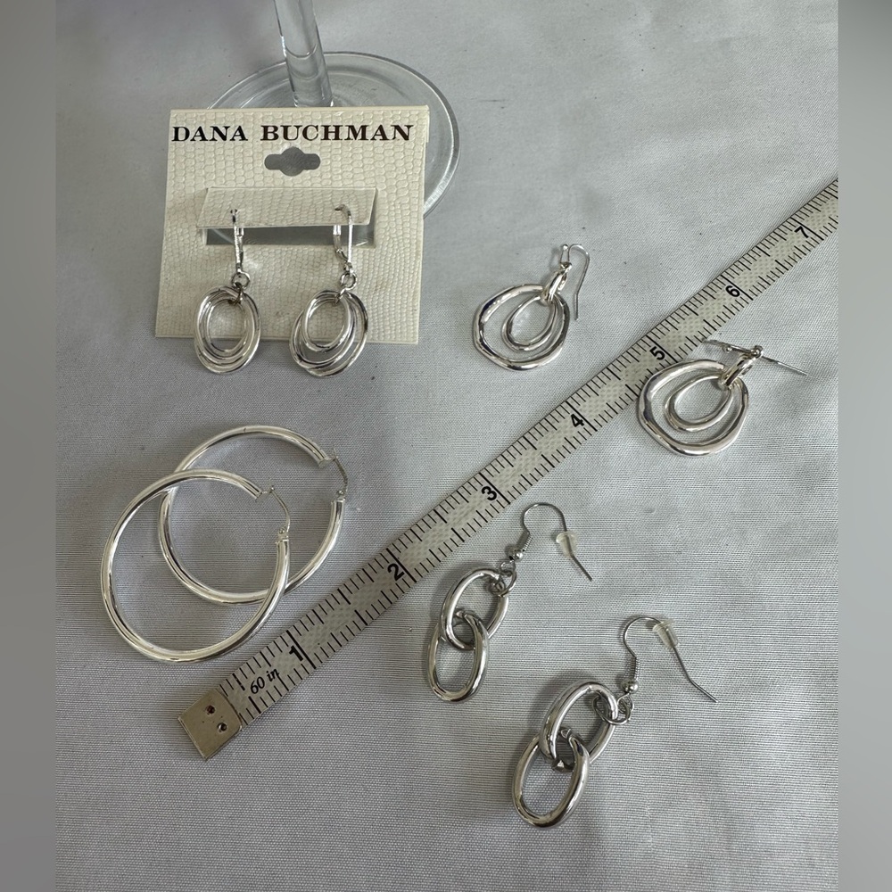 Four pair silvertone earrings hoops and links style